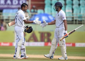 Rohit Sharma (R) congratulates Mayank Agarwal after the latter's maiden Test 100
