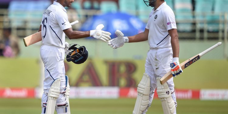 Rohit Sharma (R) congratulates Mayank Agarwal after the latter's maiden Test 100