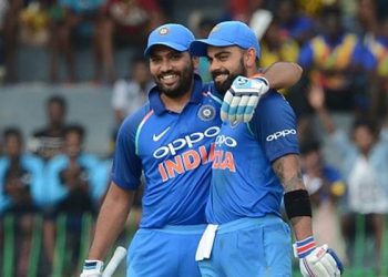 Indian cricket captain Virat Kohli (R) is congratulated by his teammate Rohit Sharma after scoring a century (100 runs) during the fourth one day international (ODI) cricket match between Sri Lanka and India at R. Premadasa Stadium in Colombo on August 31, 2017. / AFP PHOTO / LAKRUWAN WANNIARACHCHI        (Photo credit should read LAKRUWAN WANNIARACHCHI/AFP/Getty Images)