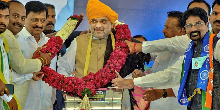 BJP president being welcomed by party workers at an election rally in Maharashtra, Thursday