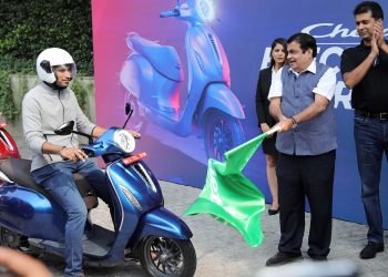 Union Transpor Minister flags off a prototype of the electronic scooter which will be launched by Bajaj Auto