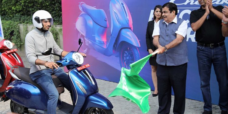 Union Transpor Minister flags off a prototype of the electronic scooter which will be launched by Bajaj Auto