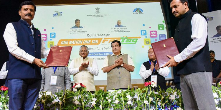 Union Minister for Road Transport and Highways and Micro, Small and Medium Enterprises, Nitin Gadkari witnessing the exchange of the agreements, at the inauguration of the Conference on One Nation One Fastag, in New Delhi, Monday