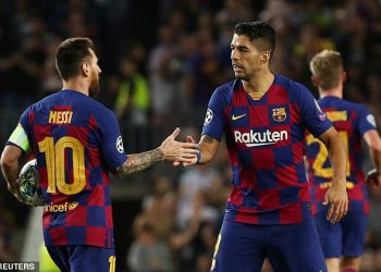 Lionel Messi congratulates Luis Suarez after the latter's second goal against Inter Milan, Wednesday