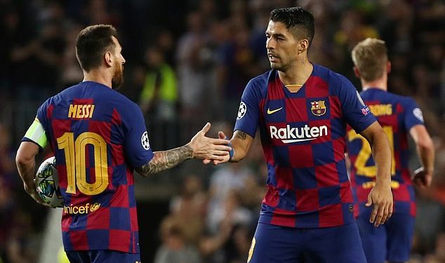 Lionel Messi congratulates Luis Suarez after the latter's second goal against Inter Milan, Wednesday