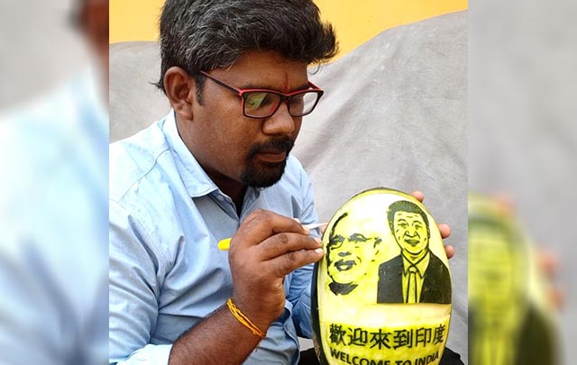 Artiste carves Modi, Xi on watermelon to welcome them