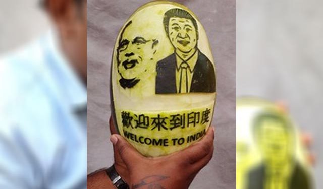 Artiste carves Modi, Xi on watermelon to welcome them