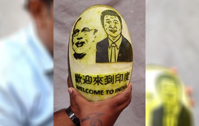 Artiste carves Modi, Xi on watermelon to welcome them