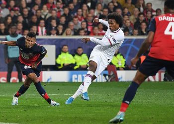 Willian (in white) volleys home the winner for Chelsea against Lille in their Champions League encounter, Wednesday