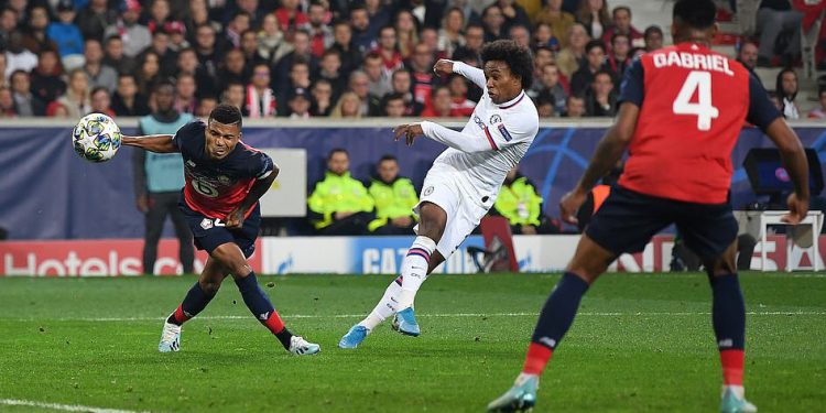 Willian (in white) volleys home the winner for Chelsea against Lille in their Champions League encounter, Wednesday