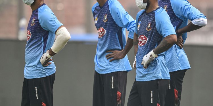 New Delhi: From left- Bangladeshi cricketers, wearing masks to protect themselves from air-pollution, during a practice session at Arun Jaitley Stadium in New Delhi, Friday.