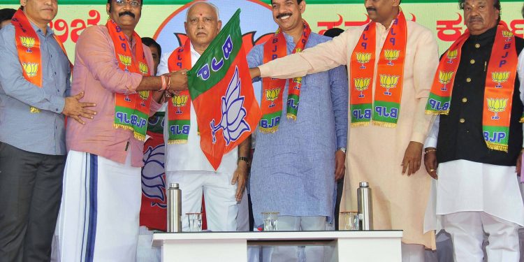 Disqualified Karnataka MLAs who joined the BJP, Thursday pose with Chief Minister BS Yediyurappa