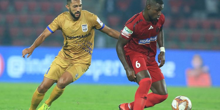 Mohamed Larbi of Mumbai City FC (L) and Jose Leudo of NEUFC fight for the ball during the game Tuesday