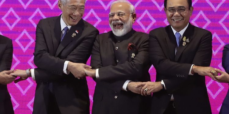 Prime Minister Narendra Modi shares a light moment with heads of state of other ASEAN countries