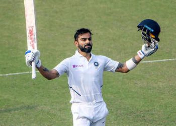 Virat Kohli celebrates his 27th Test century at the Eden Gardens, Saturday