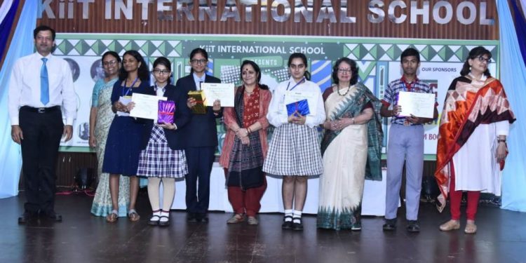 Winners of short story writing competition pose with their certificates