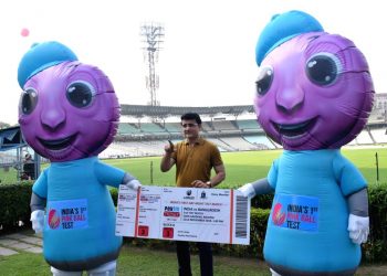 BCCI president Sourav Ganguly poses with the ticket and the mascots for the first pink ball Test in India at the Eden Gardens