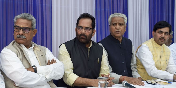Union Minority Affairs Minister Mukhtar Abbas Naqvi (2nd Left) with RSS leader Ramlal (L) and others during a meeting, at his residence in New Delhi
