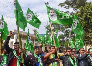 Jharkhand Mukti Morcha supporters celebrate the party’s success in the Assembly polls on the counting day in front of the residence of the party chief Shibu Soren in Ranchi (PTI)