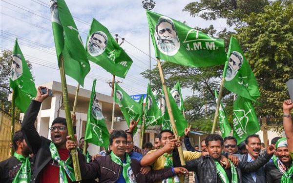 Jharkhand Mukti Morcha supporters celebrate the party’s success in the Assembly polls on the counting day in front of the residence of the party chief Shibu Soren in Ranchi (PTI)