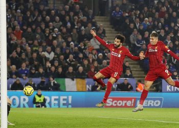 Roberto Firmino (middle) scores Liverpool's first goal with a header against Leicester City