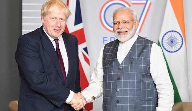 Boris Johnson (left) and Narendra Modi. File pic