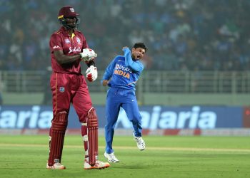 Kuldeep Yadav celebrates after dismissing Jason Holder