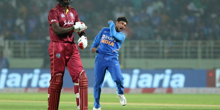 Kuldeep Yadav celebrates after dismissing Jason Holder