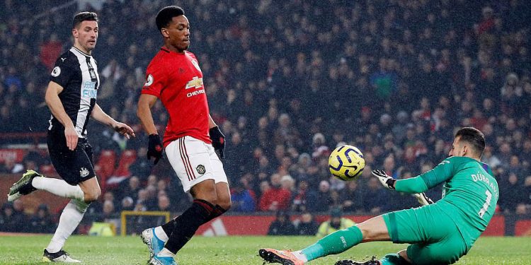 Anthony Martial (red jersey) scores one of his two goals for Manchester United against Newcastle