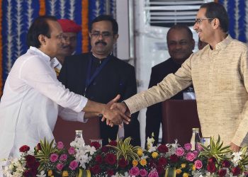 Welcome back: Maharashtra Chief Minister Uddhav Thackeray shakes Ajit Pawar's hands after the latter's swearing in as the Deputy CM