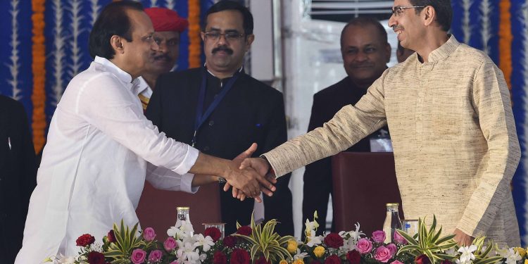 Welcome back: Maharashtra Chief Minister Uddhav Thackeray shakes Ajit Pawar's hands after the latter's swearing in as the Deputy CM