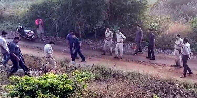 Police officials inspect the spot where the encounter took place leading to the death of all the four accused in the Hyderabad gangrape and murder case