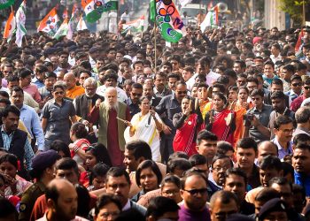 TMC supremo and West Bengal chief minister Mamata Banerjee walks with the during a protest rally against NRC and CAA in Kolkata, Thursday