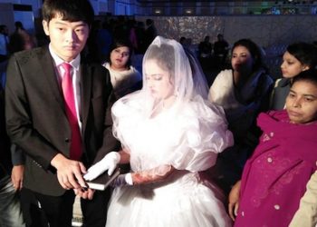 A marriage ritual between a Pakistani girl and a Chinese man being done