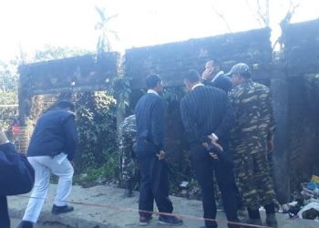 Security personnel examine a blast site at Dibrugarh