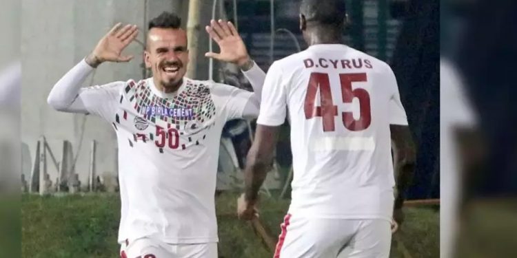 Daniel Cyrus (back to camera) celebrates with a teammate after scoring the winning goal, Thursday