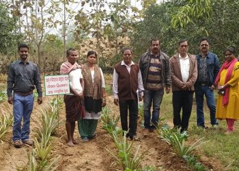 Paban Bhujabal (3rd from L) along with agriculture officials at his farm land