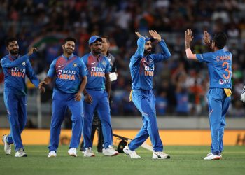 The Indians celebrate the fall of a New Zealand wicket