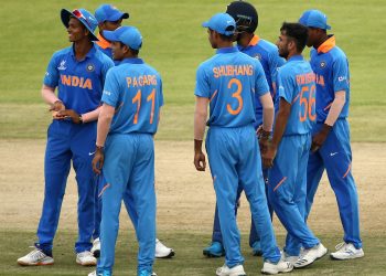 Indian players celebrate the fall of a Japan wicket