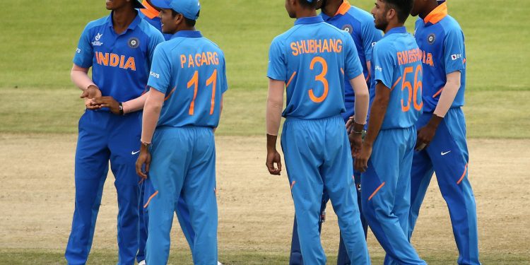Indian players celebrate the fall of a Japan wicket