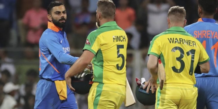 Virat Kohli congratulates Aaron Finch after the first ODI in Mumbai