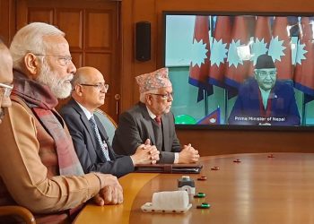 Prime Minister Narendra Modi and his Nepalese counterpart KP Sharma Oli (on the screen) jointly inaugurate the second Integrated Check Post at Jogbani-Biratnagar,