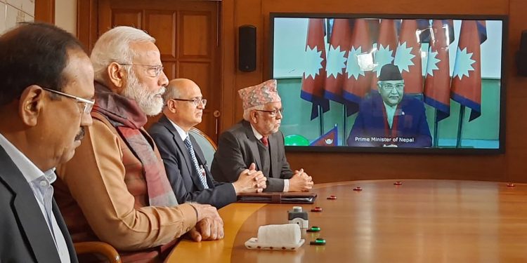 Prime Minister Narendra Modi and his Nepalese counterpart KP Sharma Oli (on the screen) jointly inaugurate the second Integrated Check Post at Jogbani-Biratnagar,
