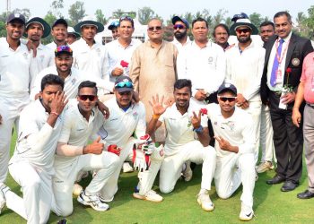 Odisha cricketers pose for a group photo after their win over Assam, Thursday