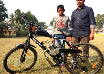 Siblings behind hybrid bicycle