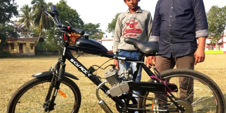 Siblings behind hybrid bicycle