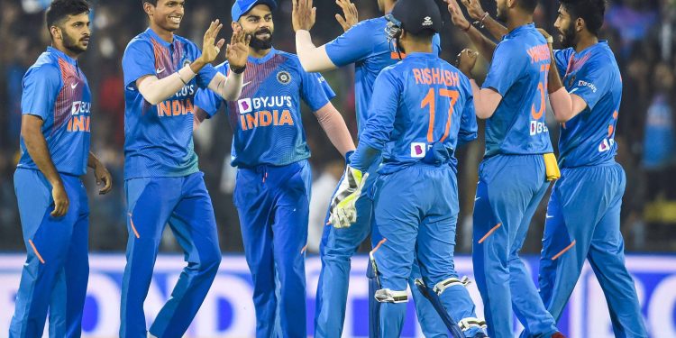 Indian players rush to congratulate bowler Navdeep Saini after he dismissed a Sri Lankan batsman, Tuesday