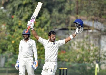 Bengal batsman Manoj Tiwary raises his bat after scoring a triple hundred against Hyderabad