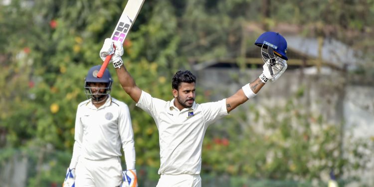 Bengal batsman Manoj Tiwary raises his bat after scoring a triple hundred against Hyderabad