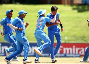 Kartik Tyagi celebrates with teammates after dismissing an Australian batsmen in the U-19 World Cup